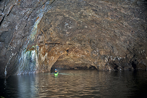 kayakers in painted cave inner chamber